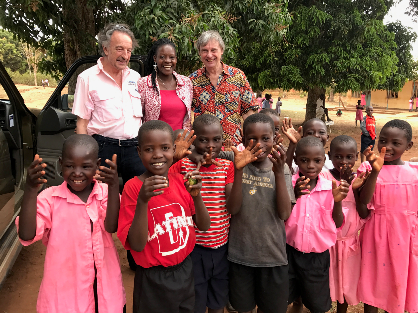 CoU Chairman, John Faith, and UK Trustee, Jon Exton & BSUF Founder, Annette Mbedha with some younger kiddies